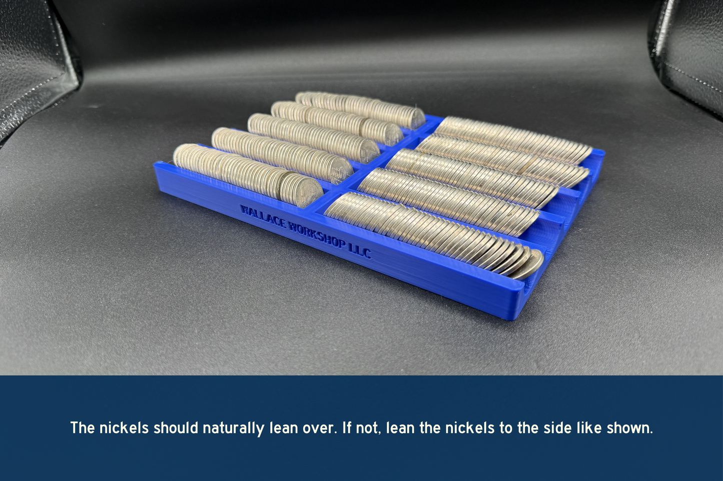 Set of nickels in a blue holder on a dark surface