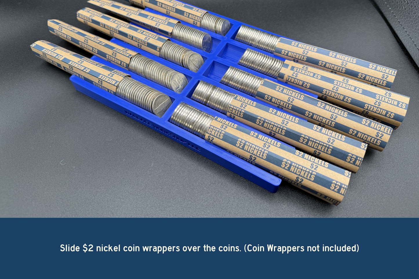 Coin wrappers with $2 nickels on a gray surface, with text indicating coin wrappers are not included.